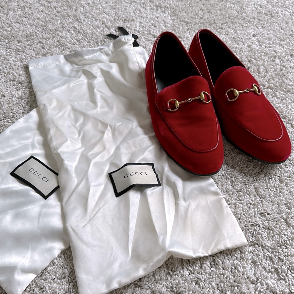 Red Gucci loafers.